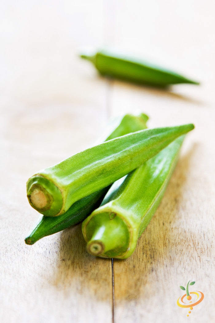 Fresh green okra Clemson Spineless pods on wooden surface