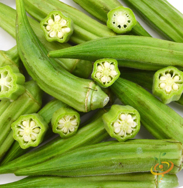 Fresh green okra pods, some cut to show seeds, Clemson Spineless variety